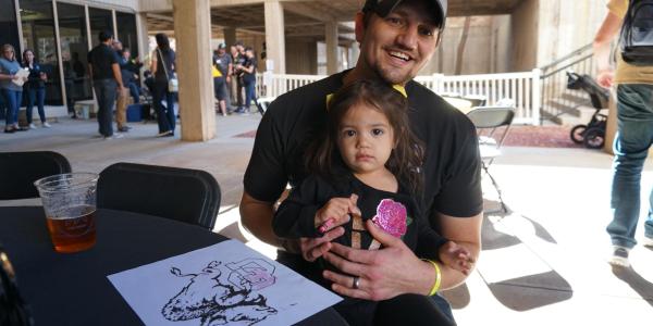 Father and daughter at the homecoming tailgate