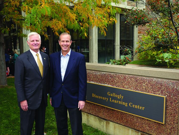 Alumnus Jim Gallogly, left, former CEO of LyondellBasell Industries and emeritus member of the CU Engineering Advisory Council, joins Mike Wirth, Chevron Corp. vice chairman and chair of the CU Engineering Advisory Council, after unveiling a sign bearing the new name for the Discovery Learning Center.