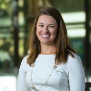 Photo of chemical engineering graduate, Amy Kramer, smiling outside the engineering center.