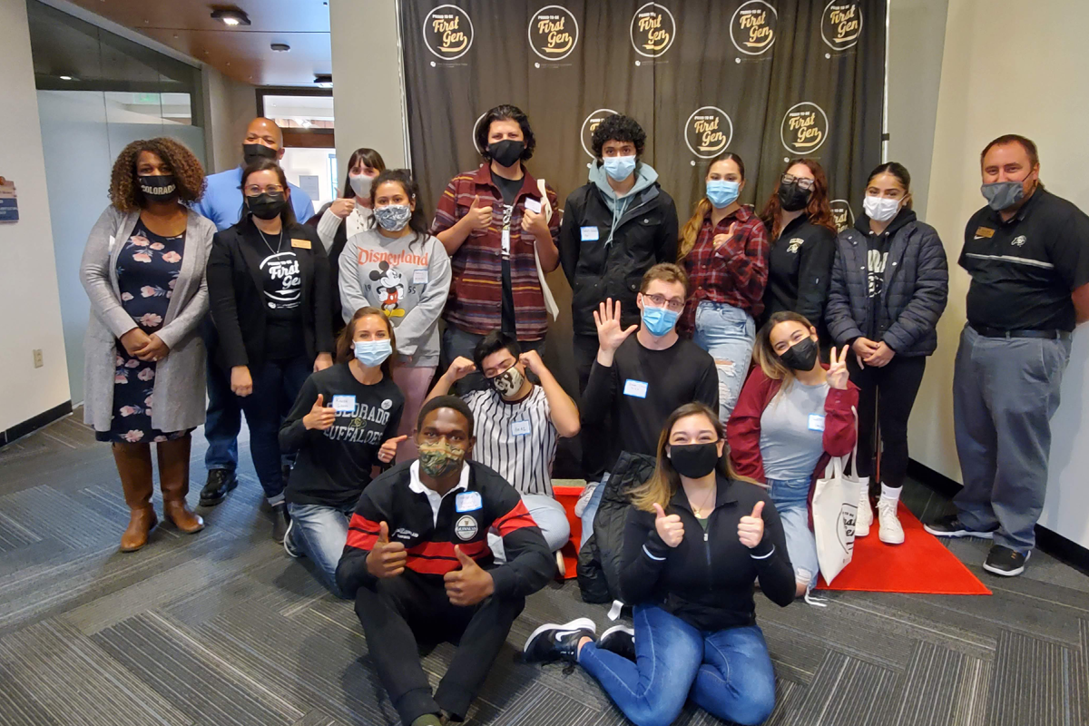 a group of first-gen students and staff pose together for a photo at an ice cream social
