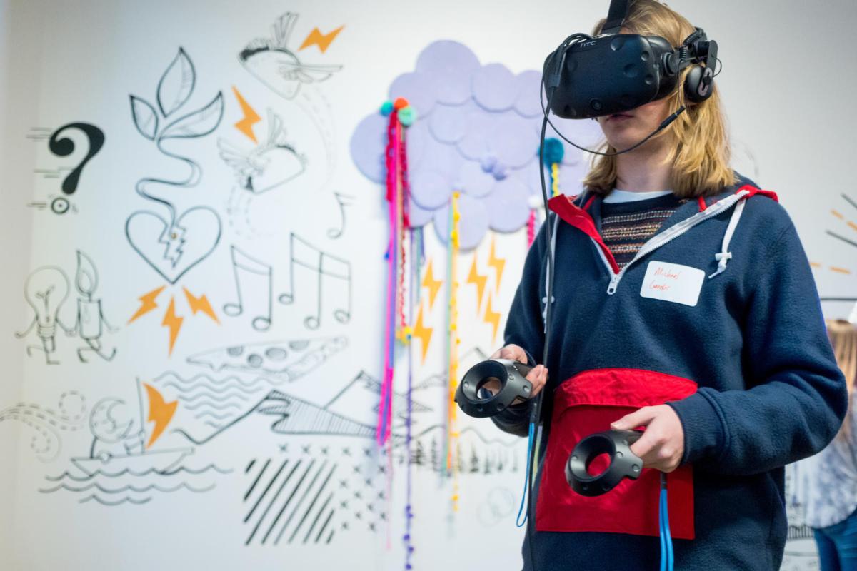 a student wearing virtual reality goggles