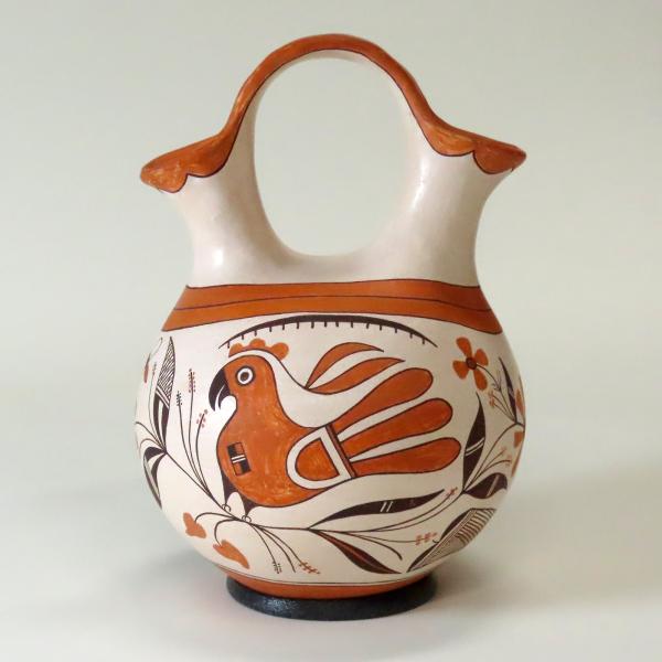 Clay pitcher with parrot painting design