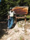 Robert Pudim standing in front of Indian Peaks Wilderness sign