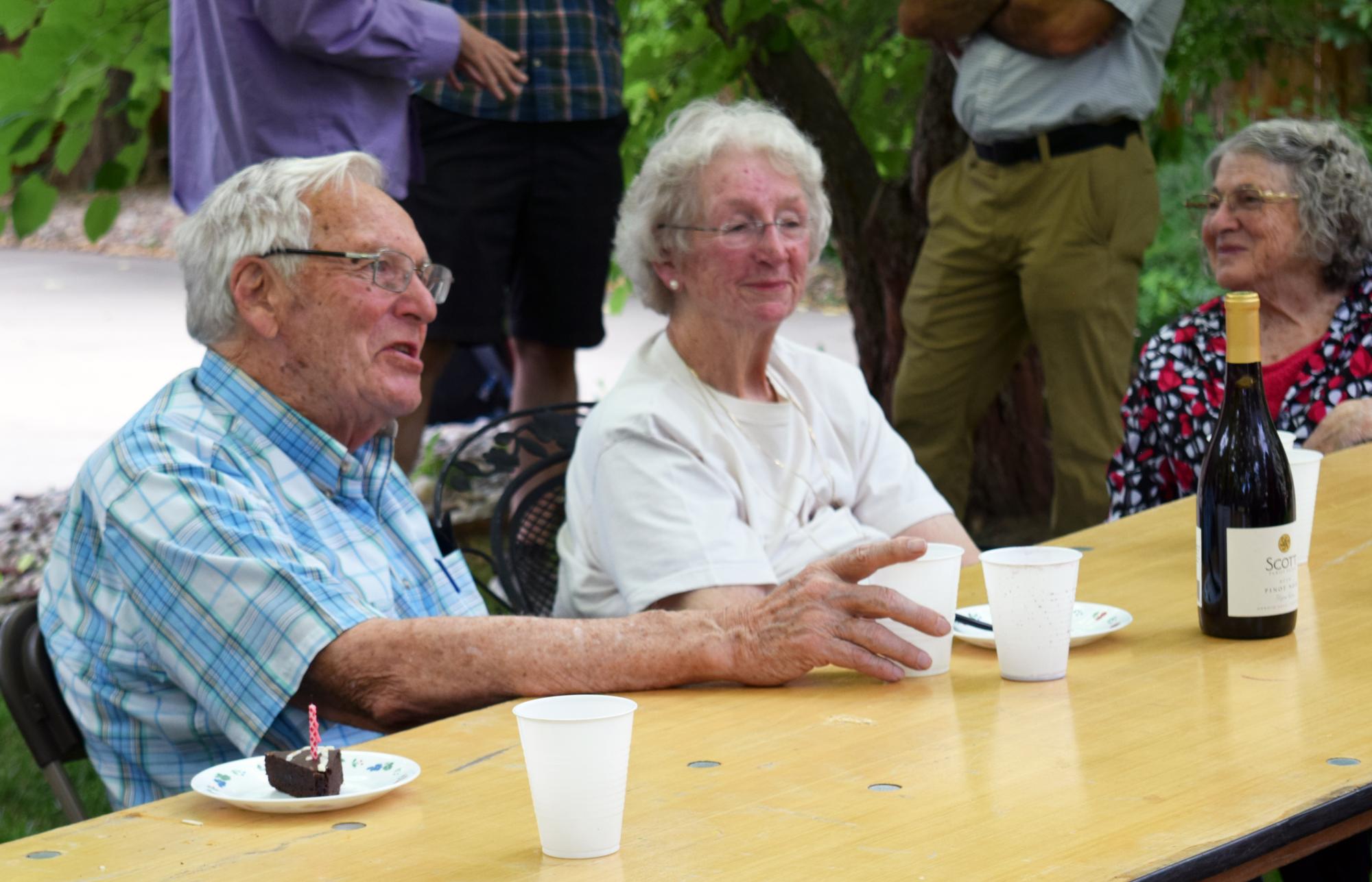 Barnes chats with guests at a backyard BBQ in celebration of his 90th birthday. 