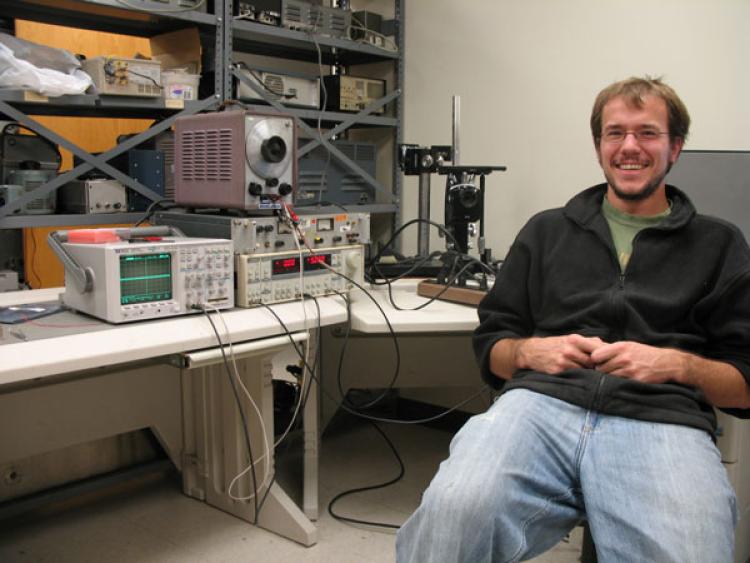 Zach Eichmeyer poses with his project in the capstone lab