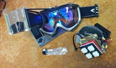 A pair of ski goggles outfitted with SkiTron's Heads Up Display system