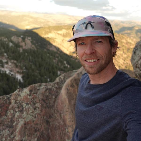 Samuel standing near the summit of the First Flatiron.