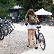 girl with bike on campus