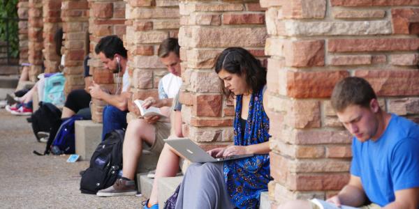 Students sitting outside UMC studying
