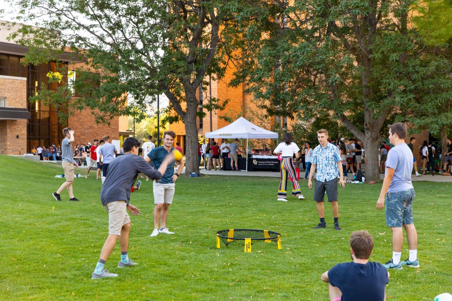 A group of students playing spike ball during a Williams Village welcome event