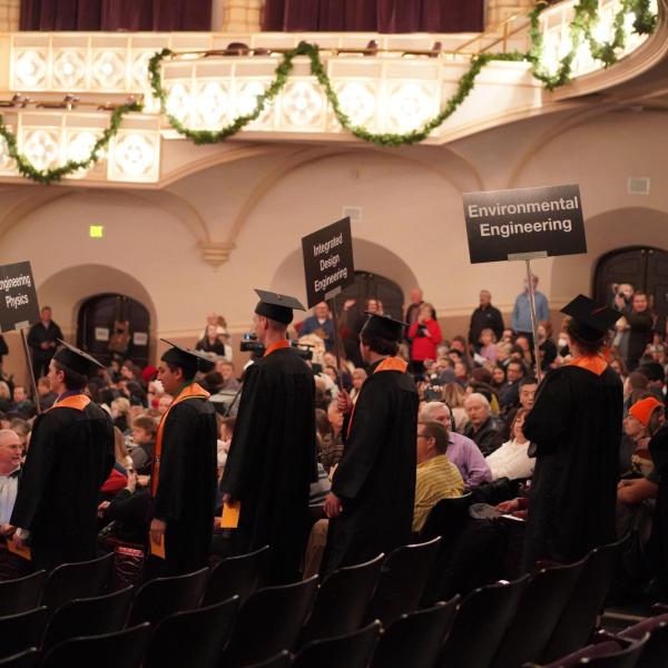 Graduates in commencement hall