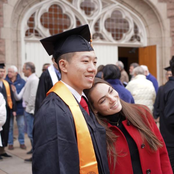 Grad posing for picture with significant other