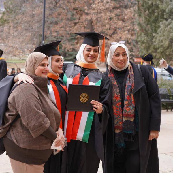 Graduates standing with family