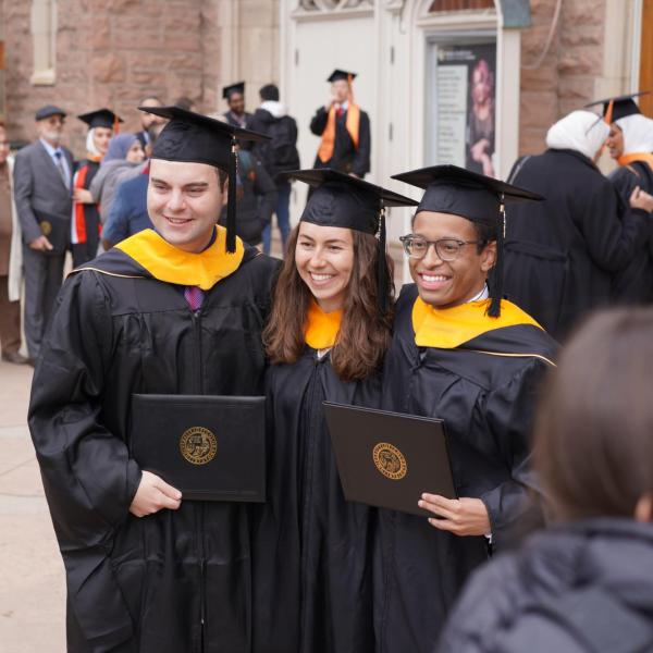 Grads standing together for group picture
