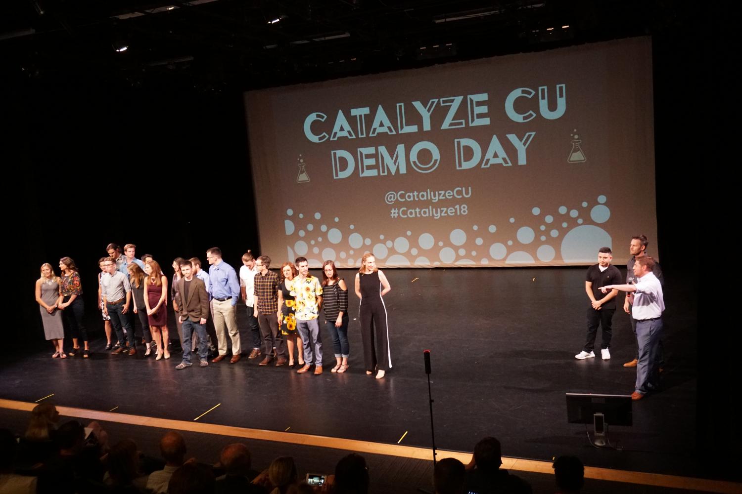 The Catalyze founders line up on stage after giving their final pitches.