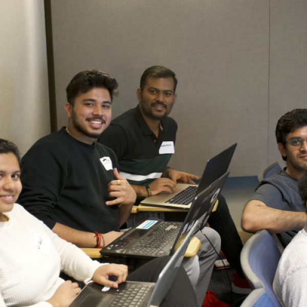 Students attend the AWS coding challenge, including Shakshi Parekh (left) and Anirudh Kalghatkar (second to left)