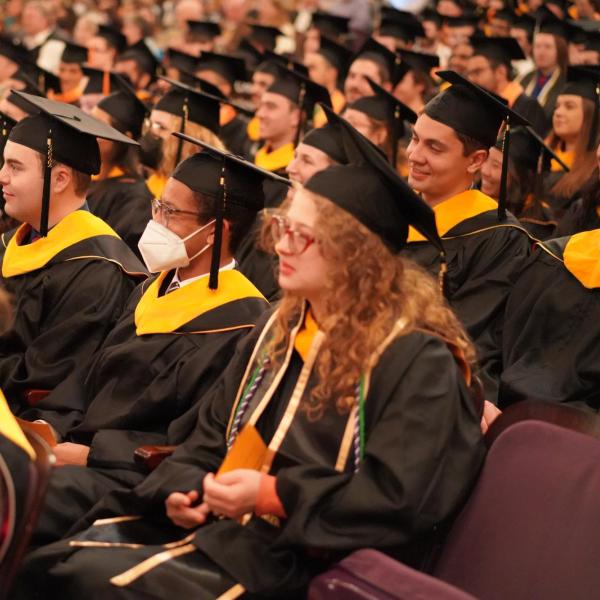 Grads sitting down