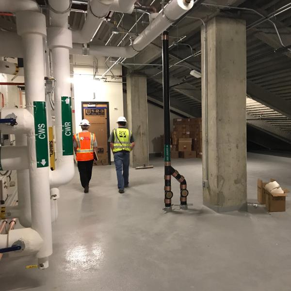 HVAC and water lines fill the upper reaches of the new wing.