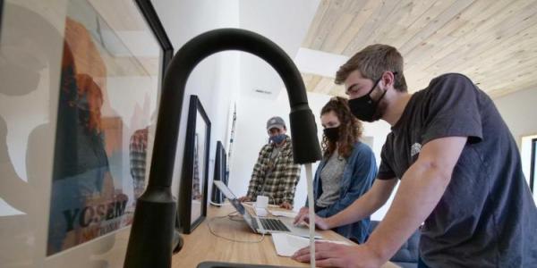 Students working in a new home on engineering problems