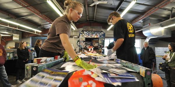 Students work in the campus recycling center