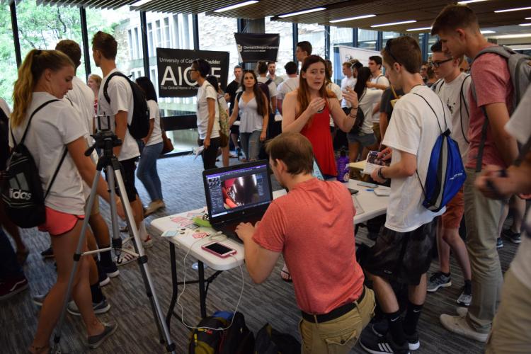 Students visit booths in the lobby during the 2017 activities fair. 