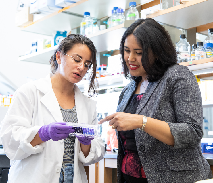 Dana Stamo, left, and Anshuree Chatterjee in the lab in the Department of Chemical and Biological Engineering at CU Boulder.