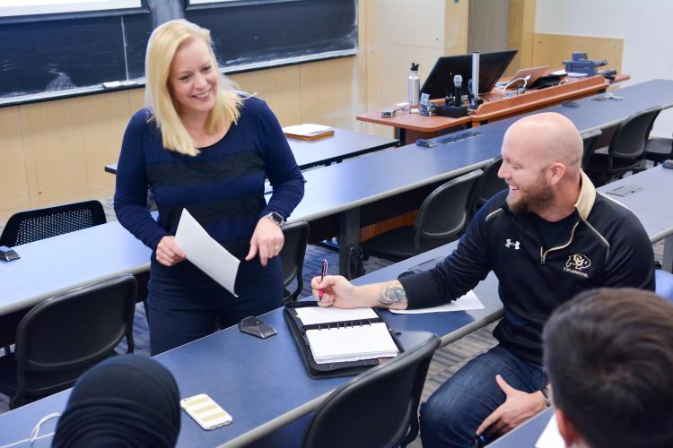 Christy Bozic talks with an EMP student.
