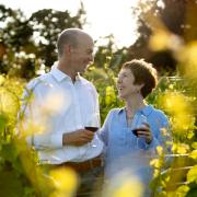 Kevin Green and wife Clodagh drinking wine in a vineyard