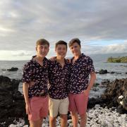 Alex, Phil, and Dom Miceli on the Pacific Ocean in Hawaii.