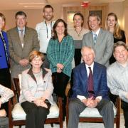 Alice and Mort Mortenson (seated), with staff and graduate students of the Mortenson Center in Global Engineering, including former managing director Robyn Sandekian and founding director Bernard Amadei (standing, second and third from left). 