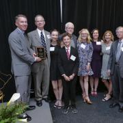 Lisa Hardaway's family accepts her Engineer of Distinction Award during the Engineering Alumni Awards Banquet. 