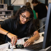 Engineering student working on electronics project