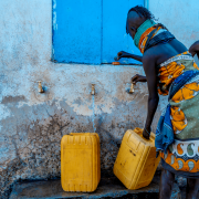 Water containers are filled from water spigots in rural Kenya.