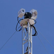 A laser system for detecting methane gas in the air sits on top of a tower at a oil and gas facility in Colorado. (Credit: Casey Cass/CU Boulder)