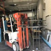 PhD student Sannidhya Ghosh uses a forklift to move concrete creep frames in the CIEST lab