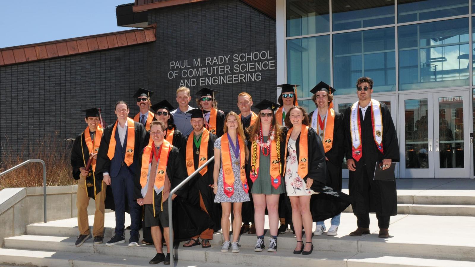 The graduates pose for a group photo outside the engineering building in Gunnison