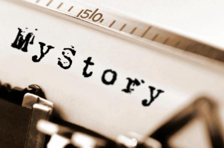 Close up of a page that says "My Story" loaded on a typewriter