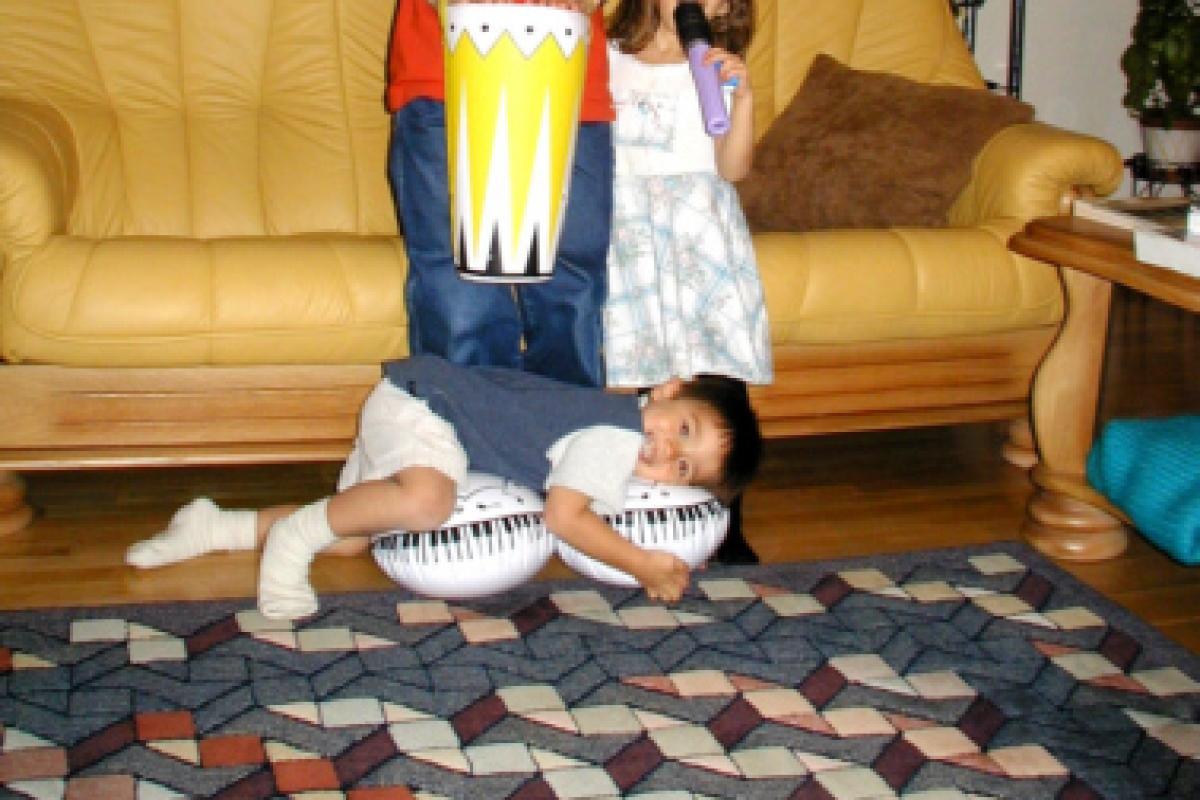Sarah and Matthew goofing around with cousin David (Nov. 2001).
