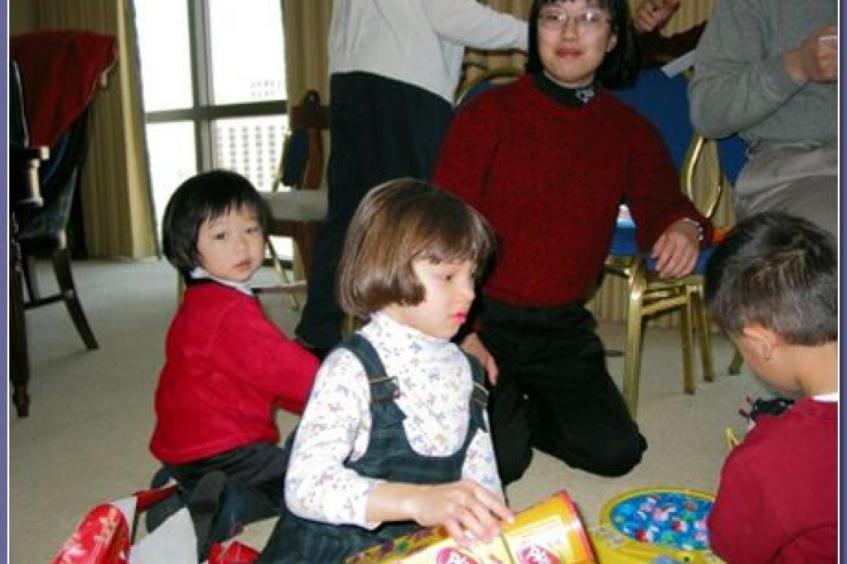 Little cousins playing with their Christmas presents in Las Vegas (Dec. 2002).