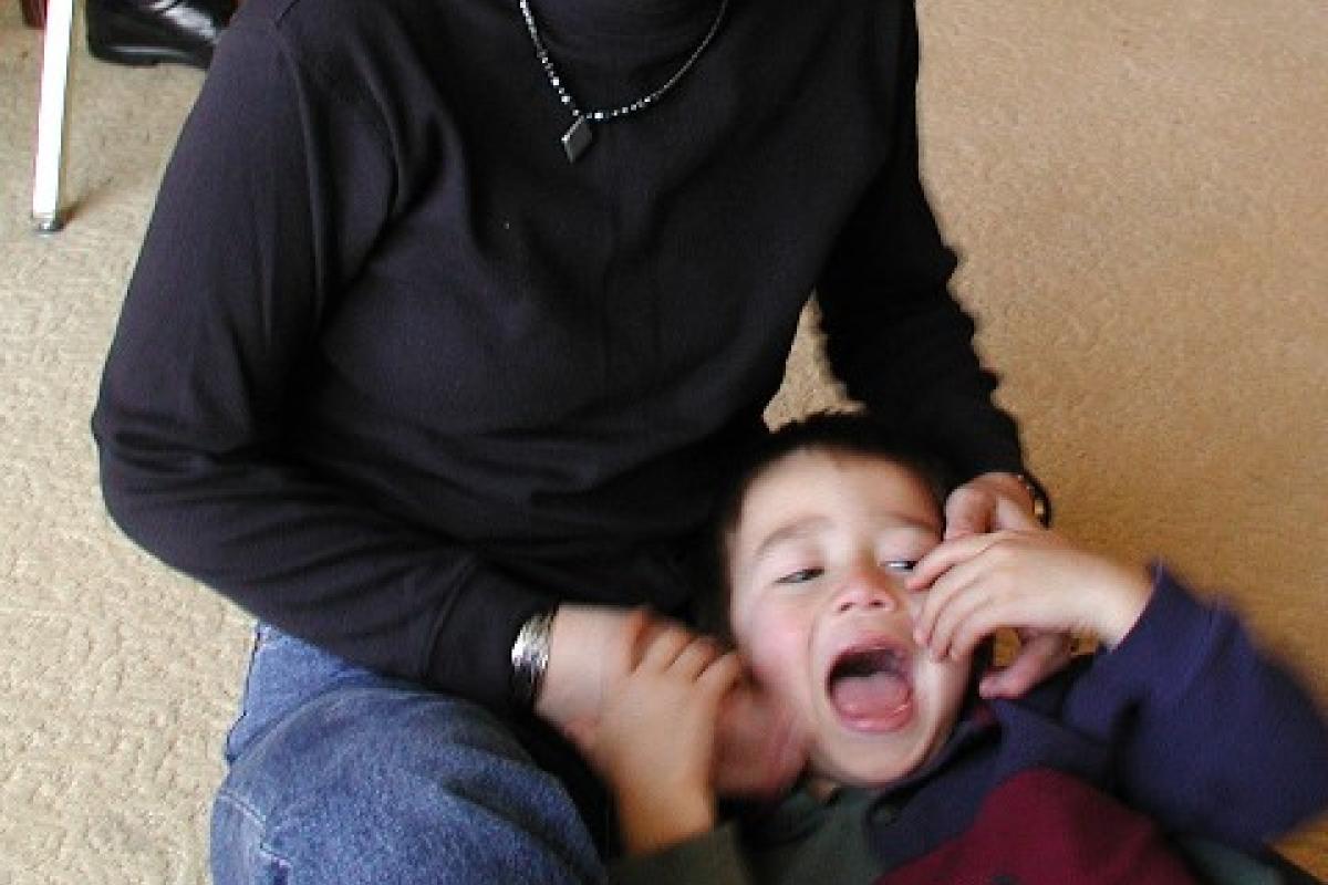 Mom torturing Matthew in Las Vegas (Dec. 2002).