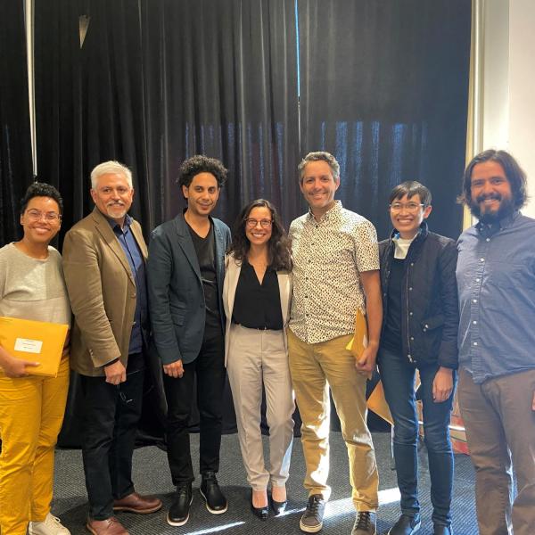 Faculty honorees standing and posing together at Fall 2022 event