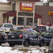 Police cars in front of King Soopers grocery store