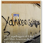 Book cover with graffiti that says "Yankee Go Home"