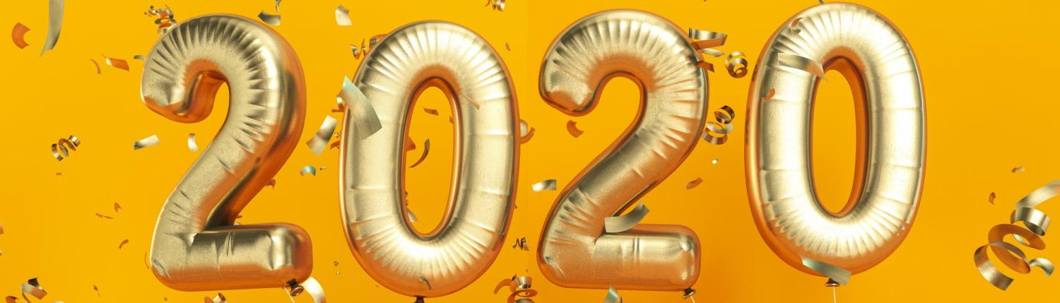 Gold balloons and confetti that spell out 2020