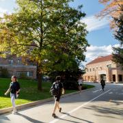 Students walking apart from each other near the Rec Center on campus.