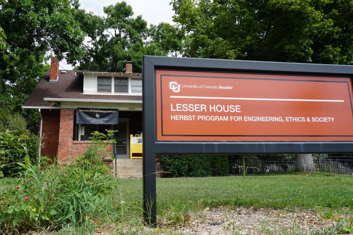 Lesser House front lawn with red sign