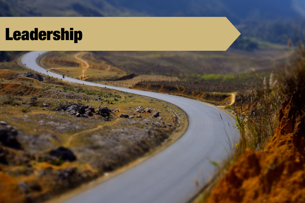 winding road with leadership banner
