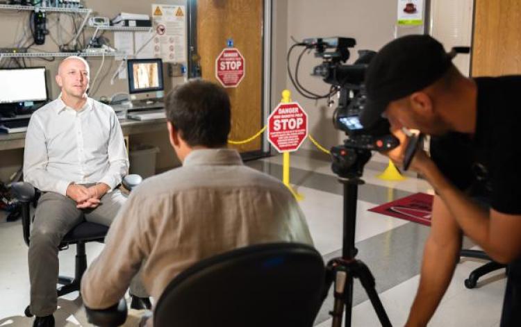Professor McKell Carter discusses his research with a documentary crew at CU Boulder's Intermountain Neuroimaging Consortium. (Photo courtesy of Teryn S. Wilkes)