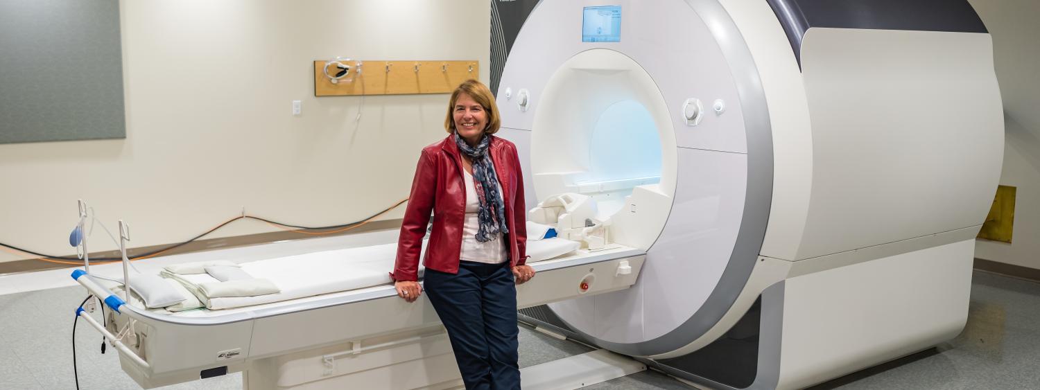 Marie Banich in front of the INC MRI.
