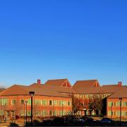 The SEEC building glows in afternoon sunlight.